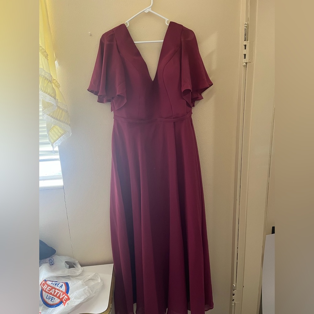 A burgundy dress. It's a size 14 and has a lace-up back. Never been worn!